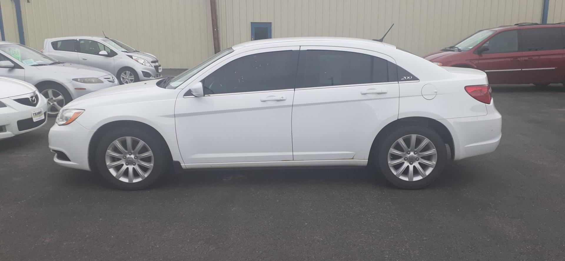 2012 Chrysler 200 Touring (1C3CCBBB9CN) with an 2.4L L4 DOHC 16V engine, 6-Speed Automatic transmission, located at 2015 Cambell Street, Rapid City, SD, 57701, (605) 342-8326, 44.066433, -103.191772 - CARFAX AVAILABLE - Photo#0